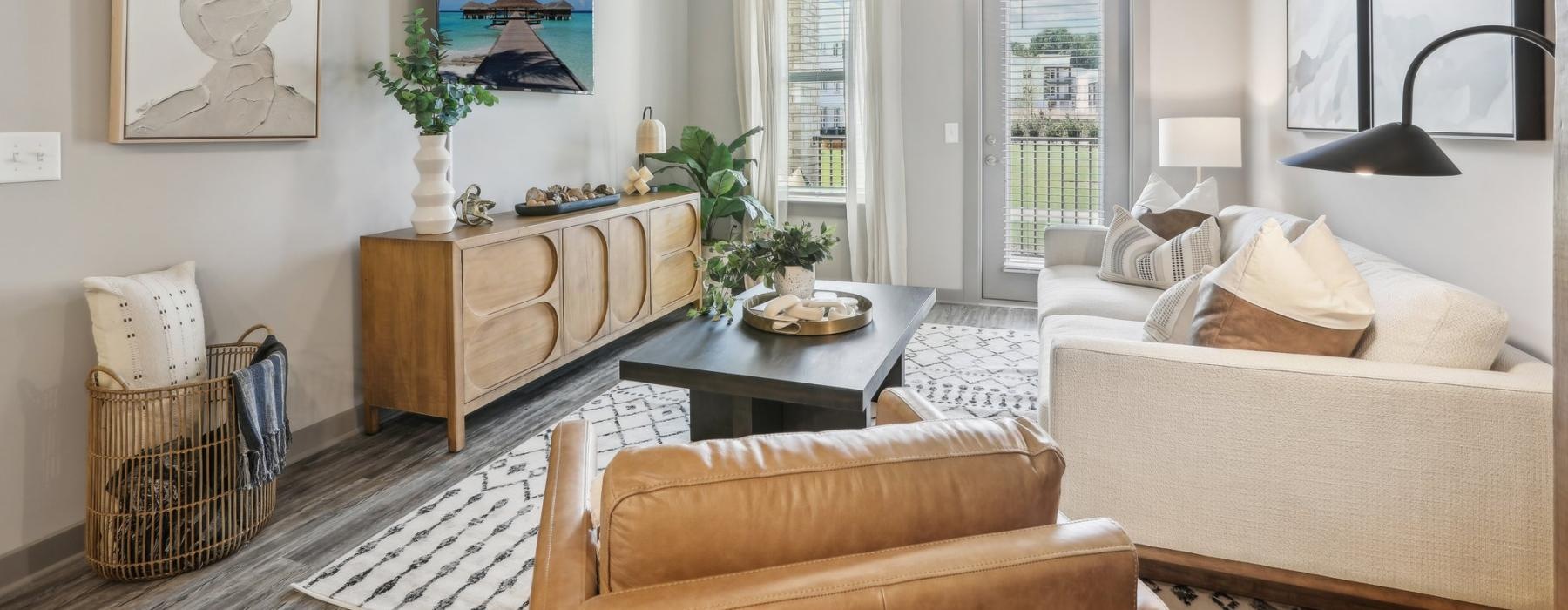 a living room with a large chandelier and a couch