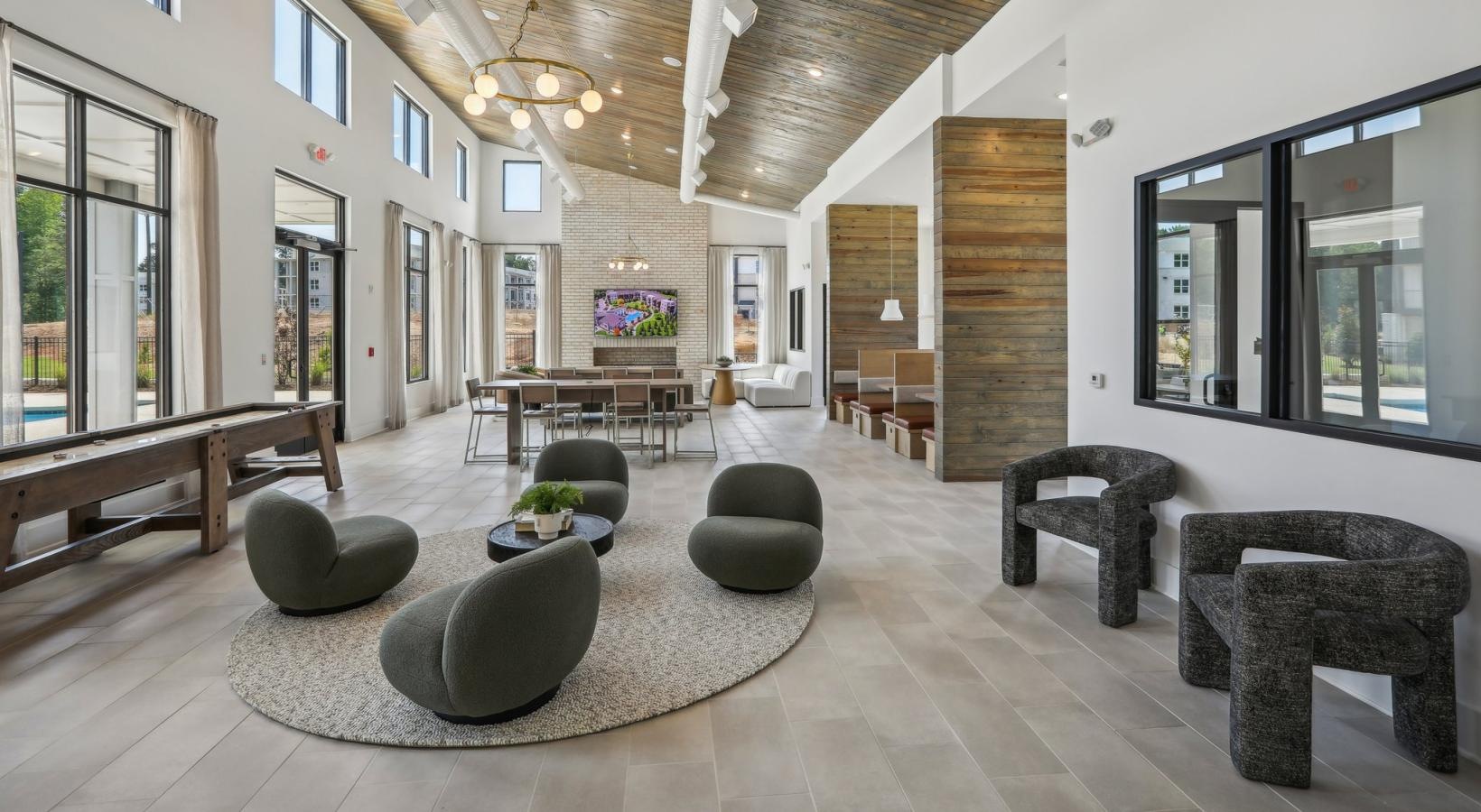 Access to resident-only features a room with a table chairs and a couch