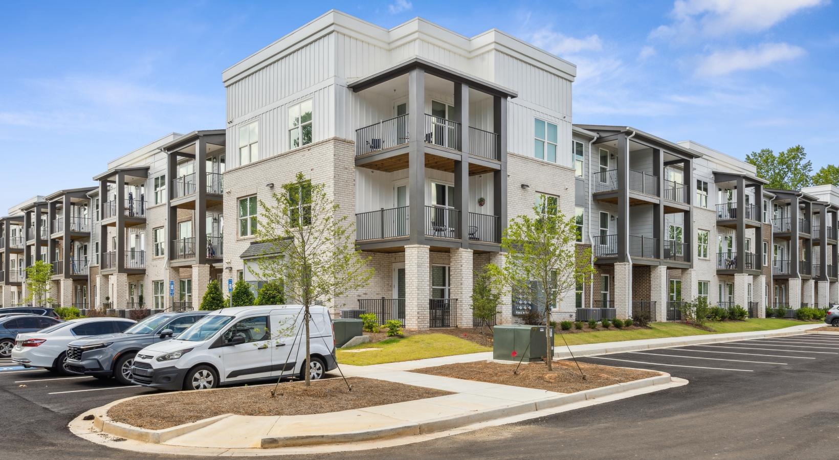 Find your perfect fit at Accent Suwanee Creek a building with cars parked in front