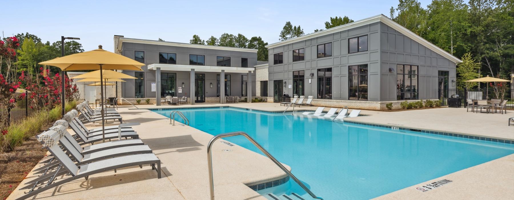 a swimming pool in front of a building