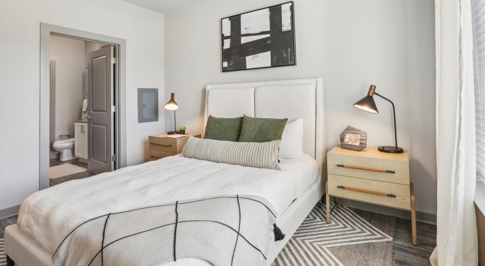 Relax and recharge in beautiful and spacious bedrooms a bedroom with a bed and a table