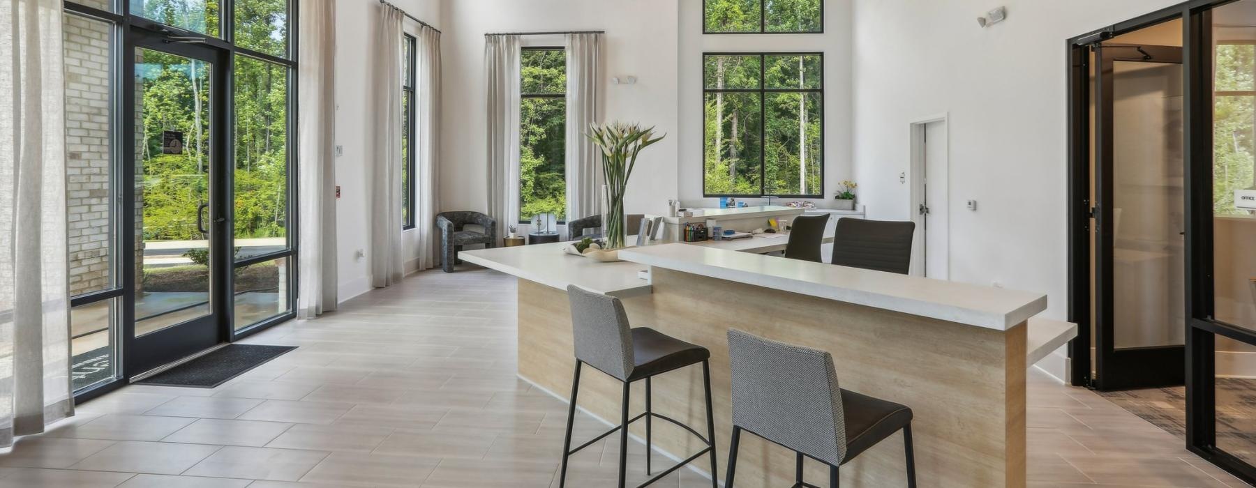 a large dining room with a large table and chairs