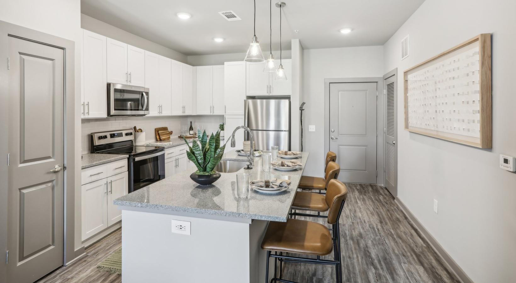 Spacious kitchens with thoughtful details a kitchen with white cabinets