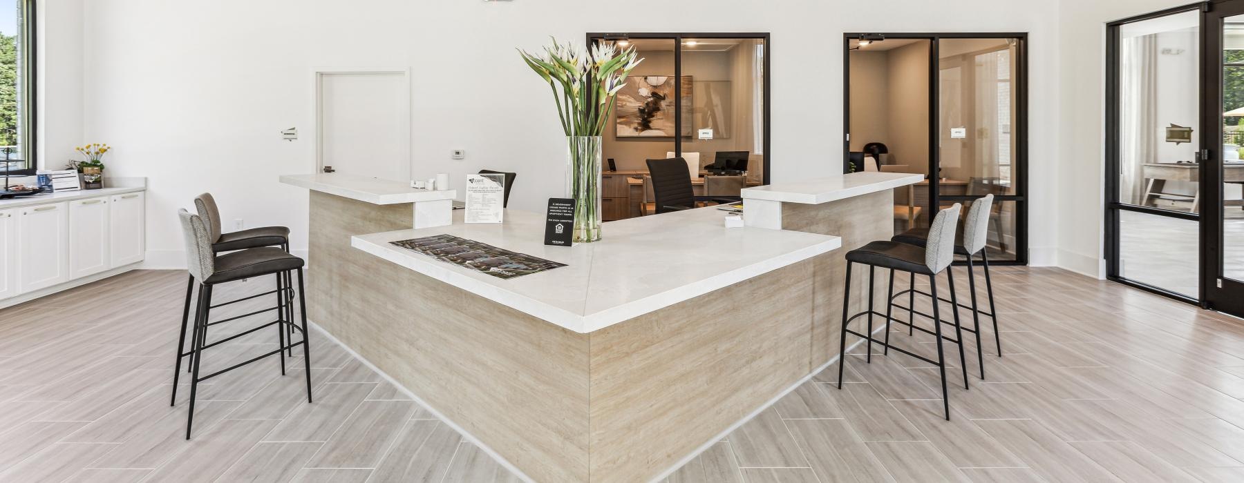 a large room with a large counter and chairs